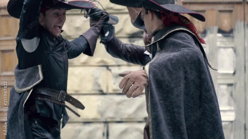 The Musketeer fights against the other two, slow motion The Musketeer fights against the other two, slow motion