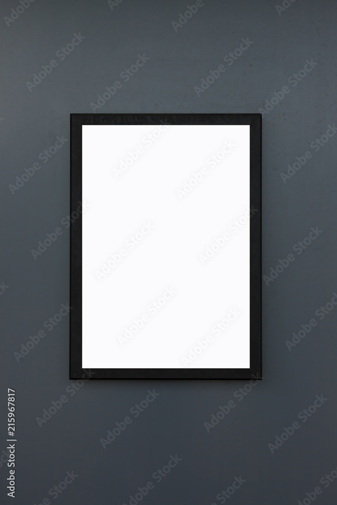 blank black frame on dark grey wall background and texture, white mock up for poster on grunge concrete panel. blank black frame on dark grey wall background and texture, white mock up for poster on grunge concrete panel.