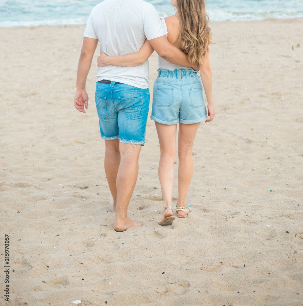 Beautiful young couple spend a day off on the beach