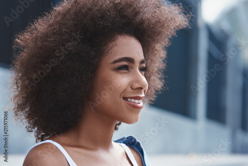 Young woman free style on the street sitting looking forward dre © Friends Stock