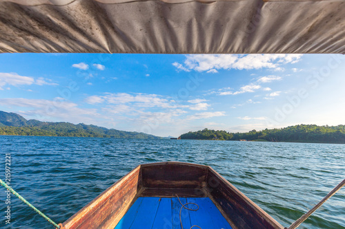 long tail boat with Unseen of The underwater old Buddhist temple, Wat Wang Wiwekaram at Sangklaburi, Kanchanaburi, Thailand