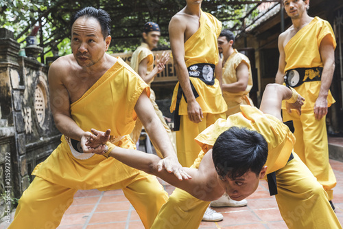 Vietnam, Hanoi, men exercising kung fu