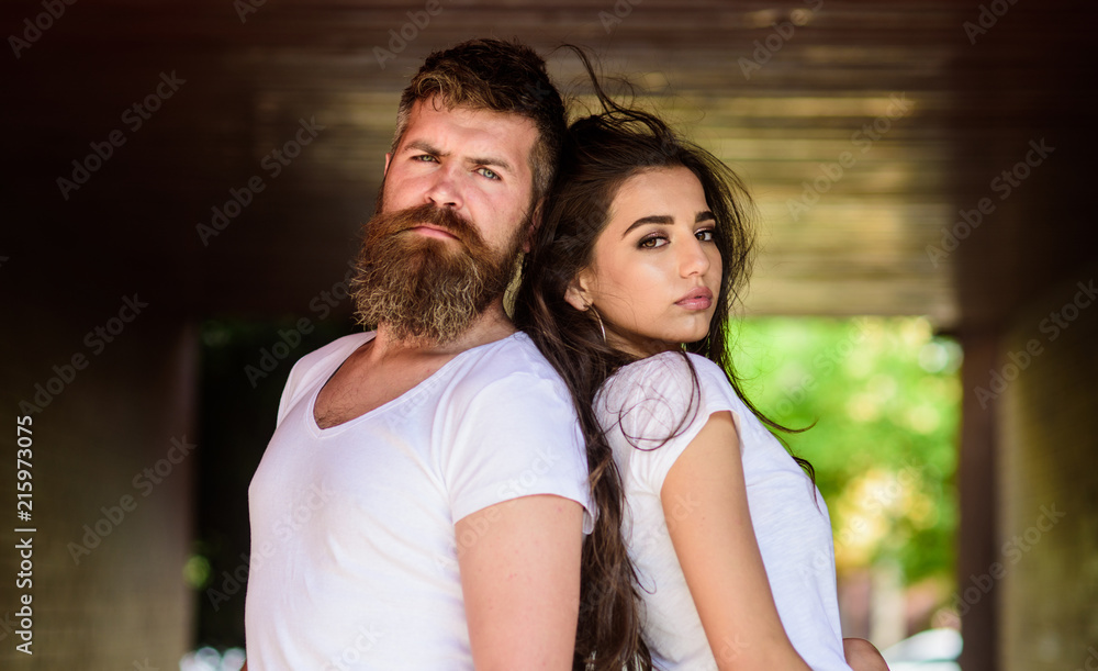 Girl attractive brunette bearded hipster man stand back to back porch underground crossing. Couple has disagreements. Couple in love can not find same point of view. Couple problems relationship