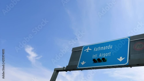 airplane flying over kathmandu airport signboard photo