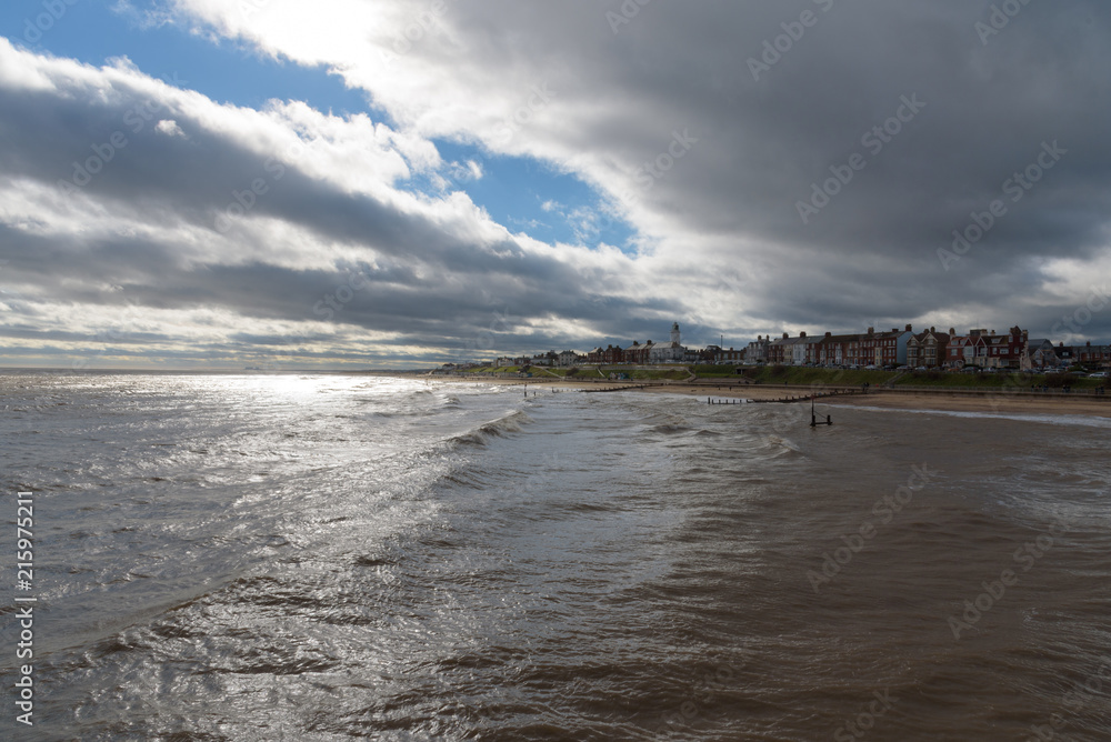 Fototapeta premium Southwold Seafront with Contrasting Sun and Clouds