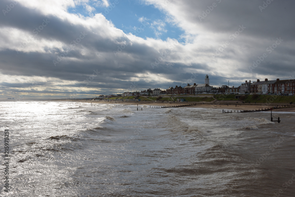 Southwold Seafront with Bright Sun, Big Waves and Stormy Clouds
