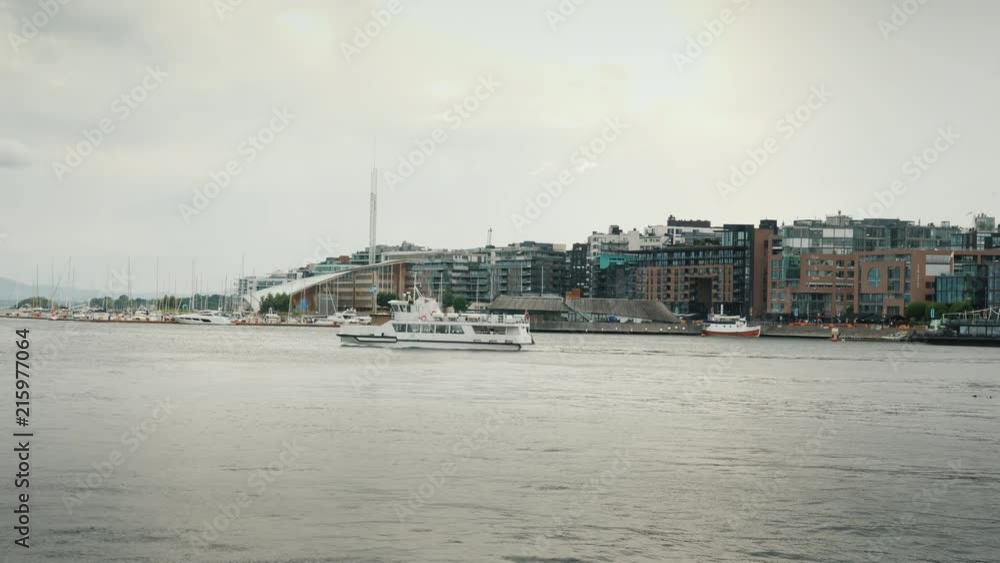 A view of the city of Oslo with the recognizable town hall building.