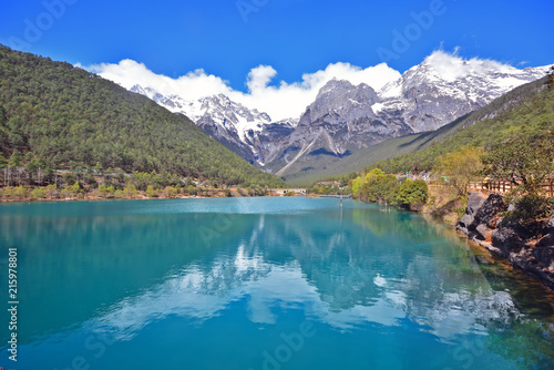 Blue moon valley  beautiful blue lake with snow mountain reflection on water  attraction in Yulong or Jade Dragon snow mountain national park in Yunnan  Lijiang  China