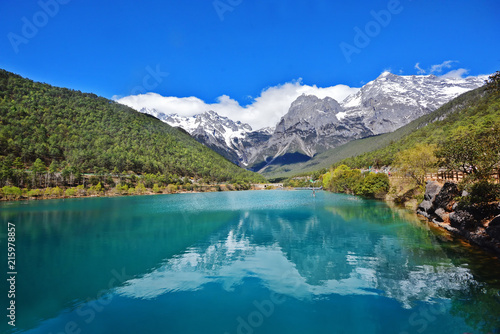 Blue moon valley, beautiful blue lake with snow mountain reflection on water, attraction in Yulong or Jade Dragon snow mountain national park in Yunnan, Lijiang, China