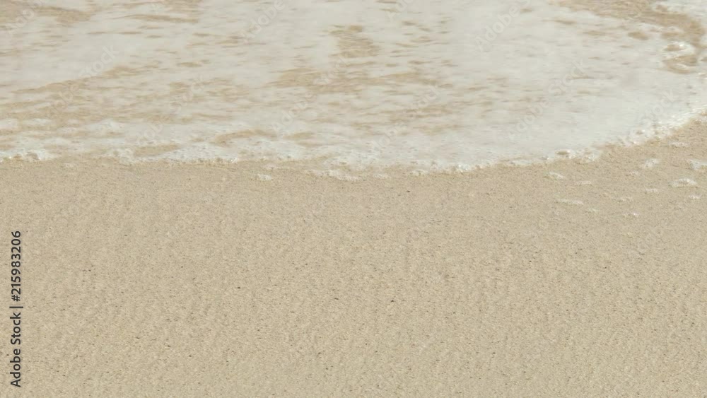 Sea wave over sand on beach for Holiday background, 4k Video Footage Clip. Sea wave over sand on beach for Holiday background, 4k Video Footage Clip.