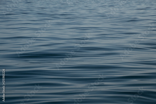Fototapeta Naklejka Na Ścianę i Meble -  Calm deep blue water with ripples background wallpaper