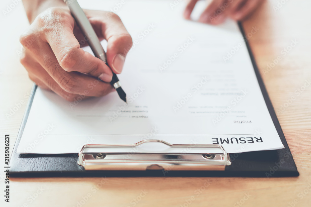 man submit resume to employer to review job application. The concept presents the ability for the company to agree with the position of the job. man submit resume to employer to review job application. The concept presents the ability for the company to agree with the position of the job.