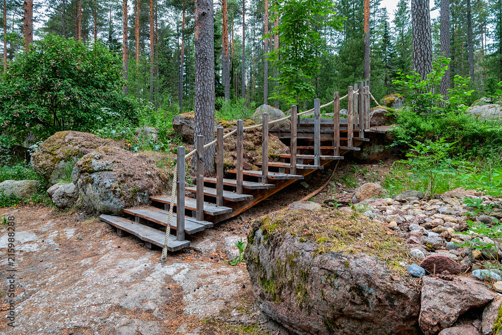 Wooden stairs on nature hiking trail in forest, Finland. Wooden stairs on nature hiking trail in forest, Finland.
