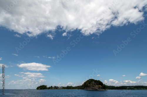 Lake Champlain with blue sky and clouds  © Guy