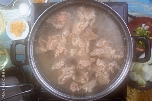 Chef scald beef with hot water for cooking