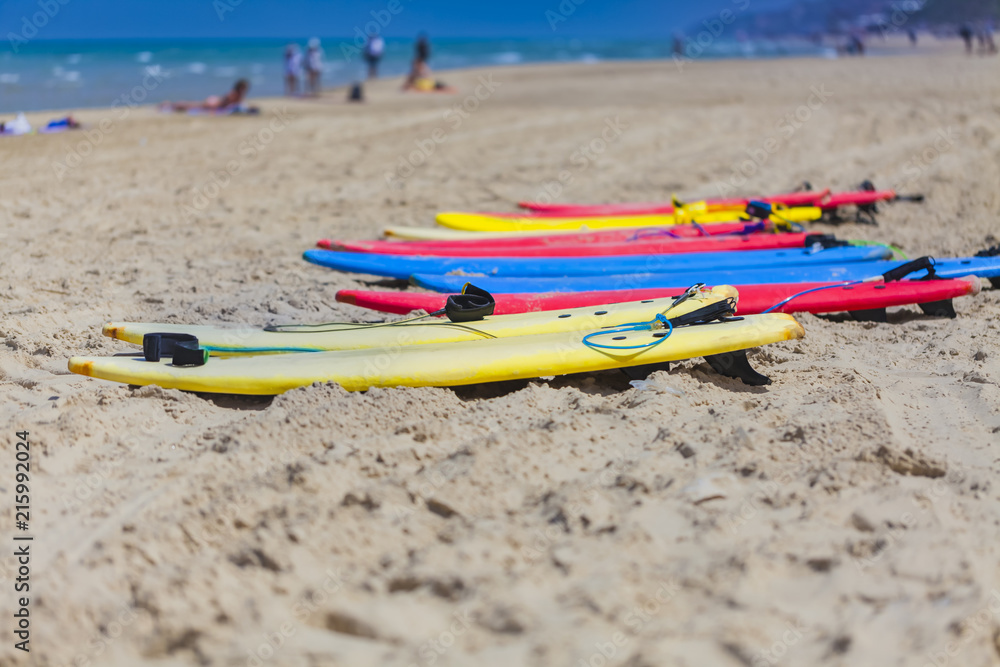 Many colorful surfboard in sand beach Many colorful surfboard in sand beach