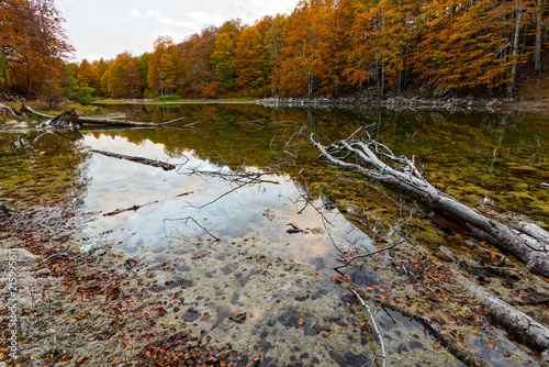 View of Arrenes or Moutsalia alpine lake on Mt Grammos in Greece during autumn photo