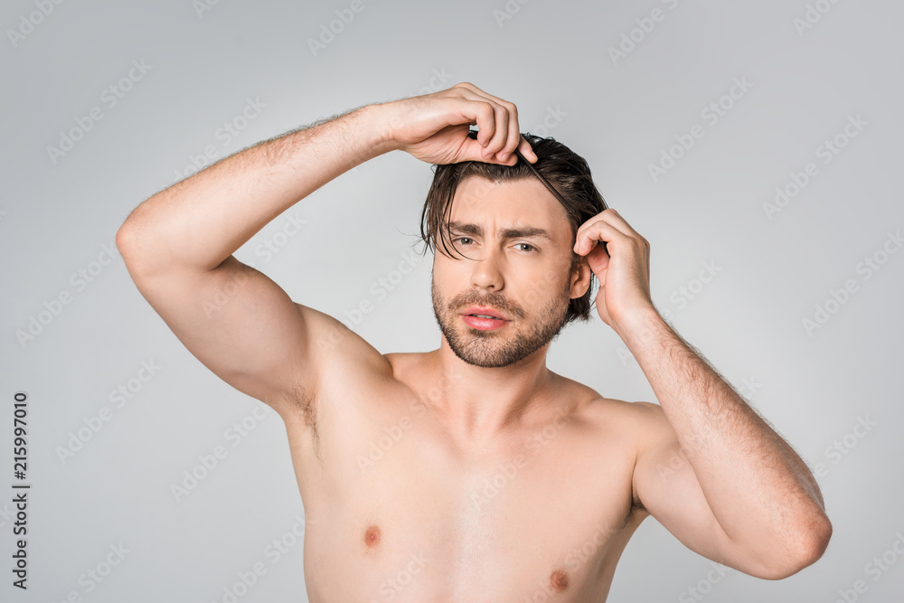 portrait of thoughtful shirtless man with stylish hairstyle isolated on grey portrait of thoughtful shirtless man with stylish hairstyle isolated on grey