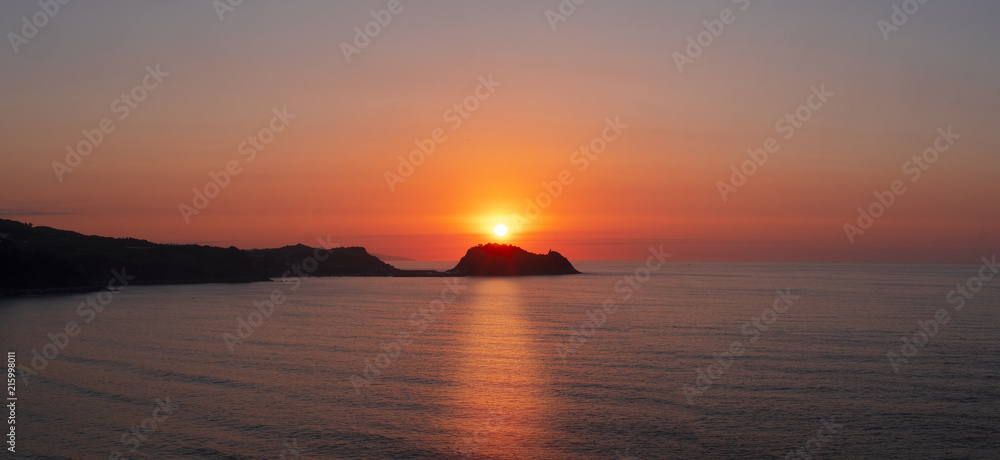 Island of San Anton and Cantabrian Sea at sunset in Getaria, Basque Country