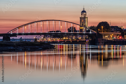 Deventer bridges over river IJssel at sunset photo