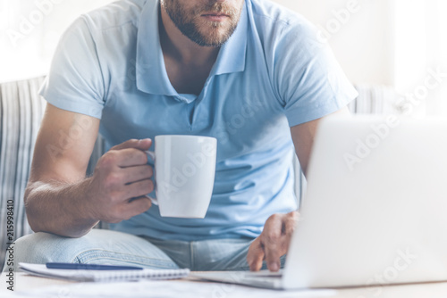Young Businessman in Casual Clothes Work at Home.