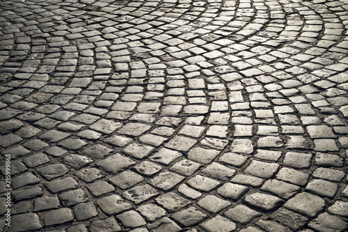 Valokuvatapetti Full frame background of old-fashioned European cobbled plaza laid out in circul