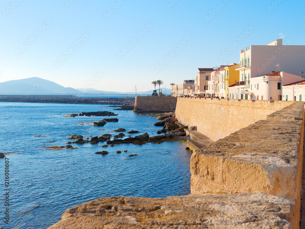 View of the sea and a fragment of Alghero defensive walls. Sardinia, Italy.