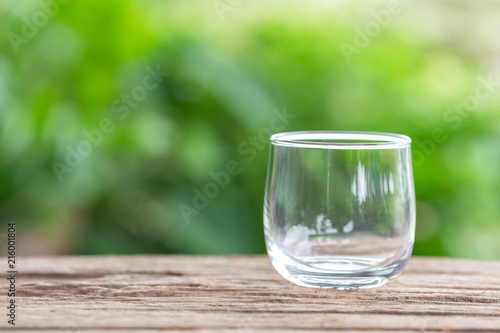 Close up empty drinking glass on wooden table