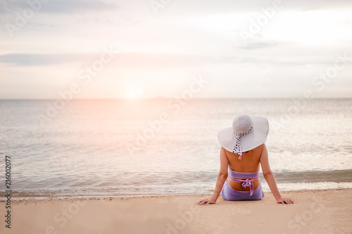 Woman enjoying sunny day on tropical beach