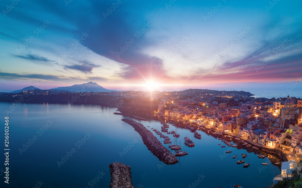 Fototapeta premium Sunset aerial view of Marina Corricella in Procida island, Italy.
