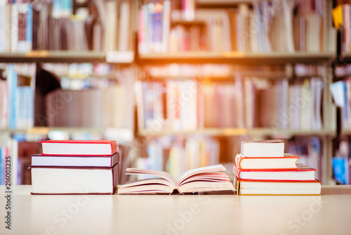 Book stack is placed on the library desk. education background, back to school concept.