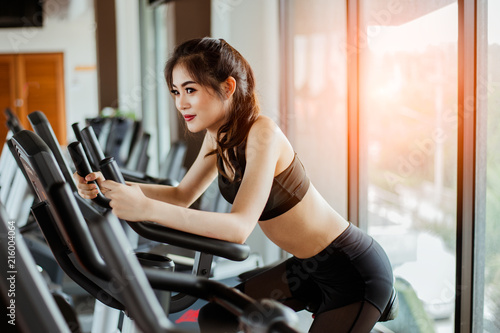 Fitness woman working out on exercise bike at the gym.exercising concept.fitness and healthy lifestyle