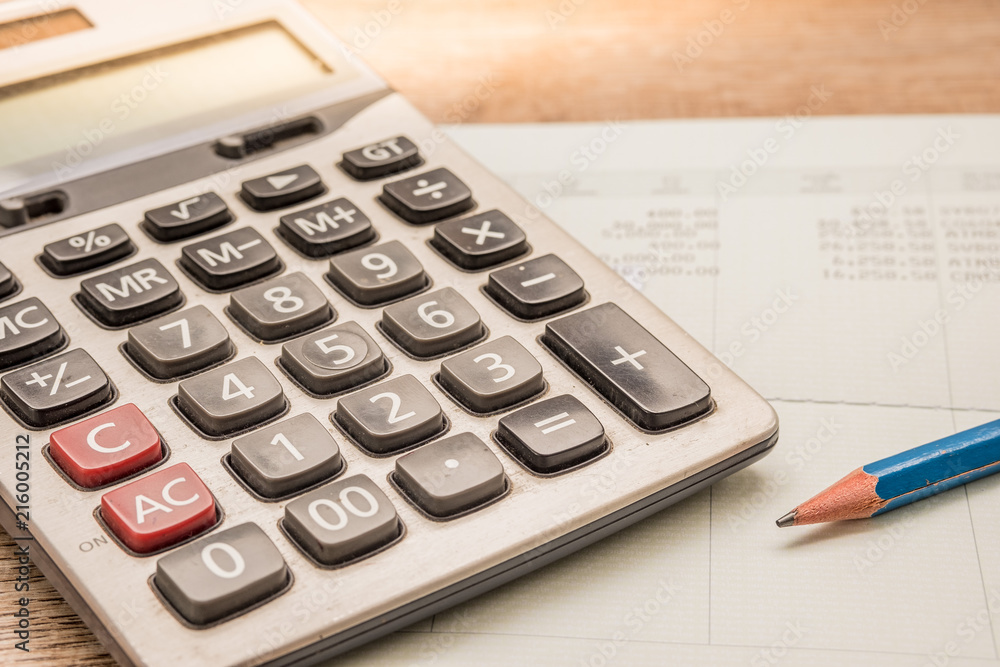 Calculator, pencil, bankbook Put on a wooden table. Calculator, pencil, bankbook Put on a wooden table.