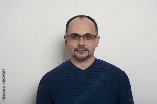 Handsome confident man in glasses portrait © Prostock-studio