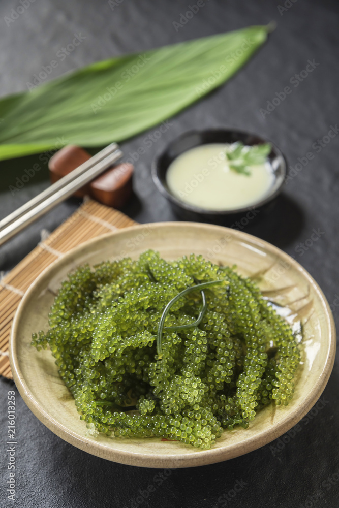 Umi-budou Seaweed or Green Caviar Healthy sea food or sea grapes seaweed on plate Umi-budou Seaweed or Green Caviar Healthy sea food or sea grapes seaweed on plate