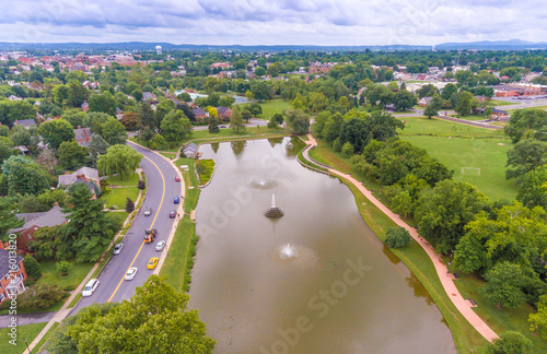 Aerial view over a pond with a town photo