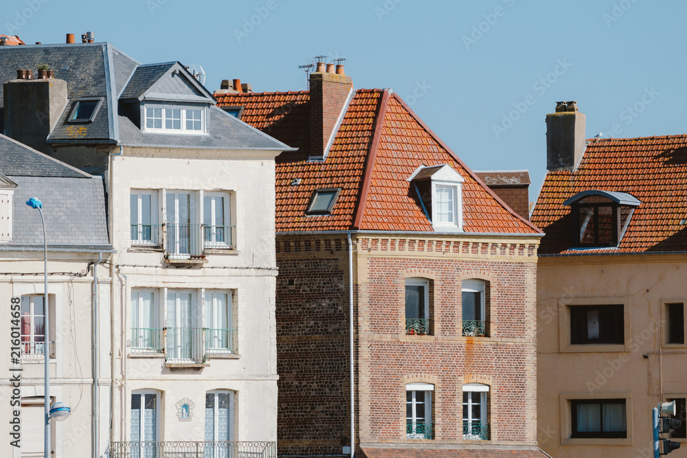 Facades of traditional residential houses with mansard stores in Dieppe, Normandy region, France. Norman style old houses. Beautiful european cityscape with typical french architecture