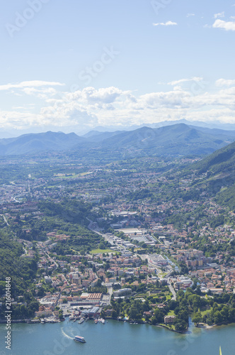 View of small town surrounded by mountains on the shores of Lake Como in Italy © Григорий Стоякин