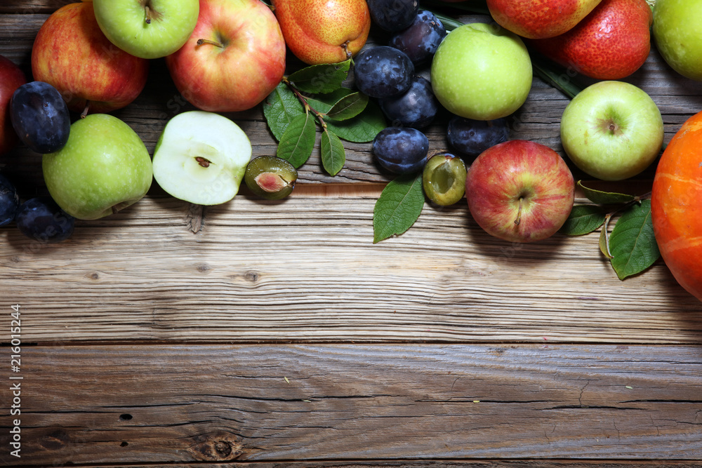Various fresh fruits. Thanksgiving pumpkin, apples, and maize on rustic background. Various fresh fruits. Thanksgiving pumpkin, apples, and maize on rustic background.
