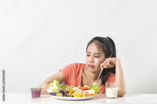  Woman does not like vegetable. Unhappy woman does not like healthy food, Emotional face.