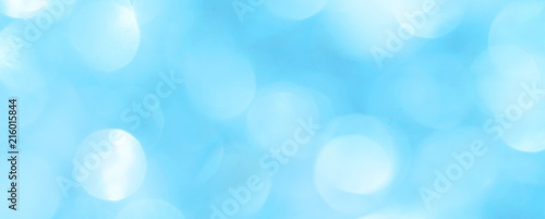 New Year shiny background with balls and blurry circles. A fashionable color palette for a holiday card.