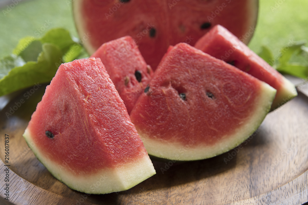 Fresh sliced watermelon wooden background Fresh sliced watermelon wooden background