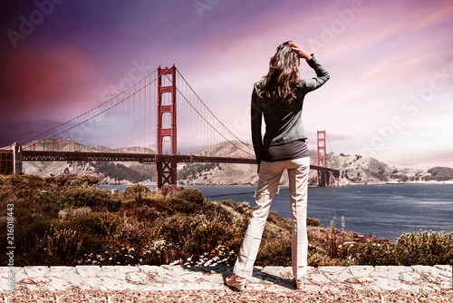 Woman standing in front of Golden Gate Bridge