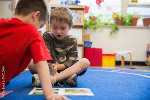 Students reading in a kindergarten classroom.  photo