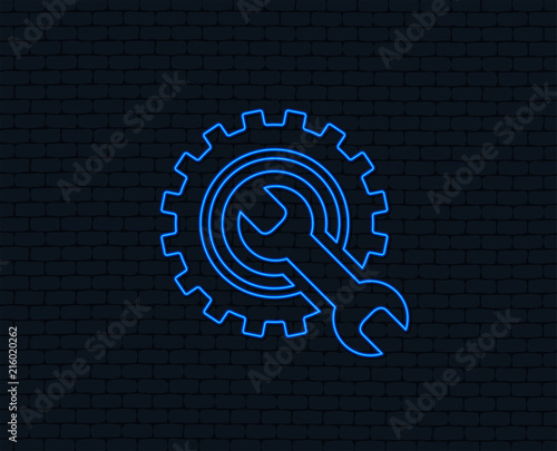 Neon light. Repair tool sign icon. Service symbol. Hammer with wrench. Glowing graphic design. Brick wall. Vector