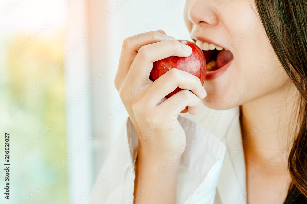 Young woman eating an apple.Human Teeth. Young woman eating an apple.Human Teeth.