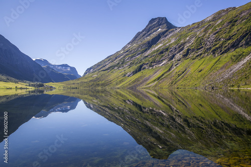 Beautiful reflection of mountains in the waters of Eidsvatnet lake