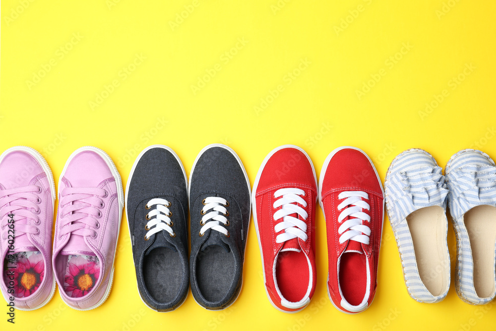 Flat lay composition with stylish new shoes on color background Flat lay composition with stylish new shoes on color background
