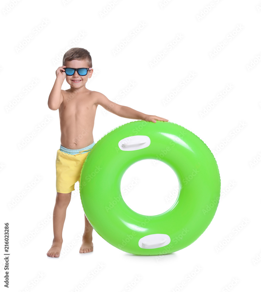 Fototapeta premium Cute little boy with inflatable ring on white background