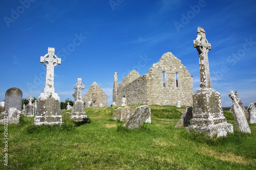 Clonmacnoise Cathedral  with the typical crosses and graves photo
